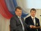 Торжественная встреча с трехкратным серебряным призером XXII зимних Олимпийских игр 2014 года в г. Сочи  М. Вылегжаниным в МБУК «Шарканский РДК». На сцене (слева направо) - министр по физической культуре, спорту и туризму УР И.В. Краснов, М. Вылегжанин. Снимок 1